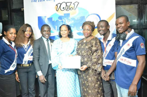 Former Dep. Governor of Lagos flanked by the Host and Crew of the Radio Show
